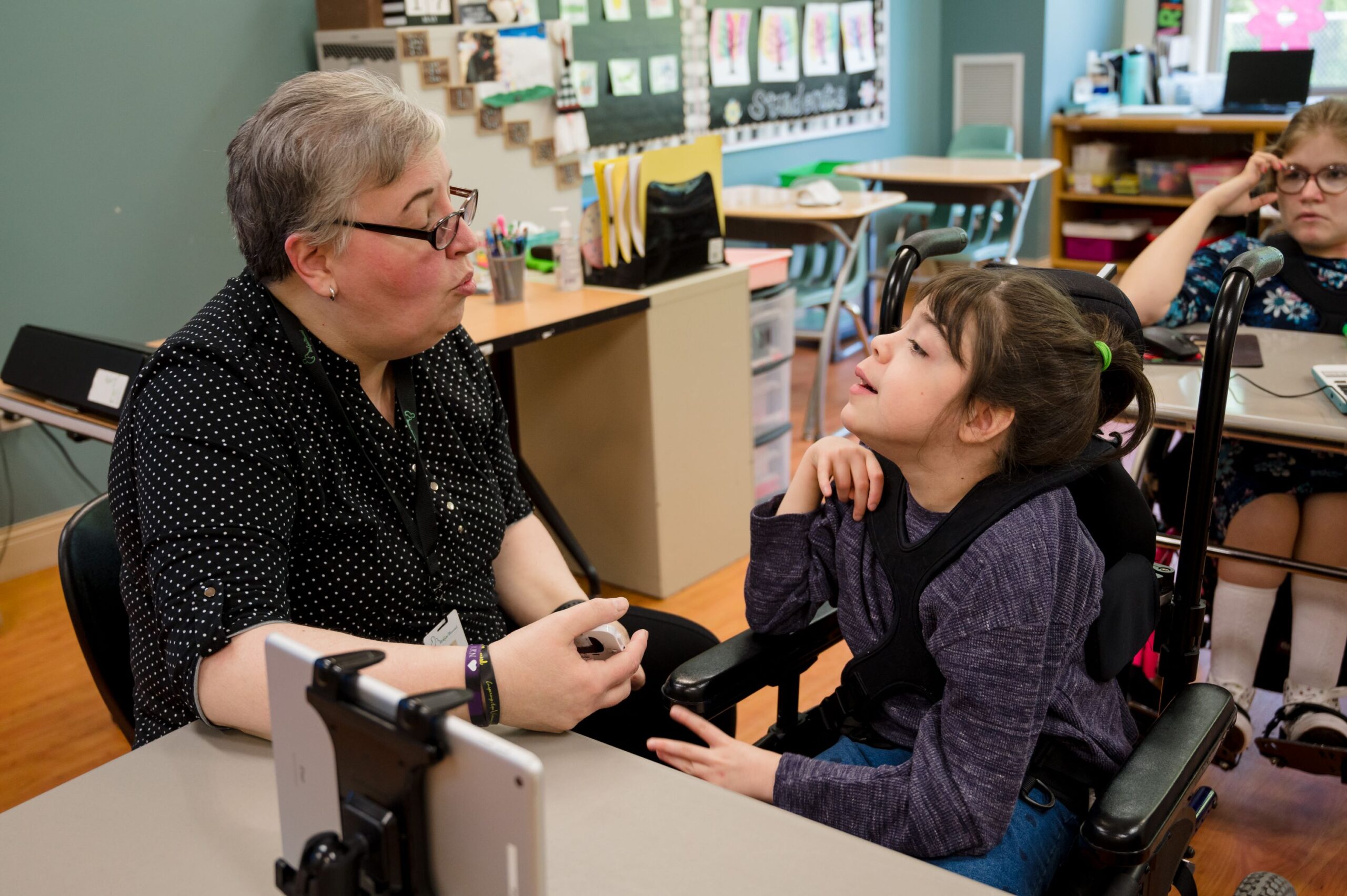 Teacher and student looking at each other. 